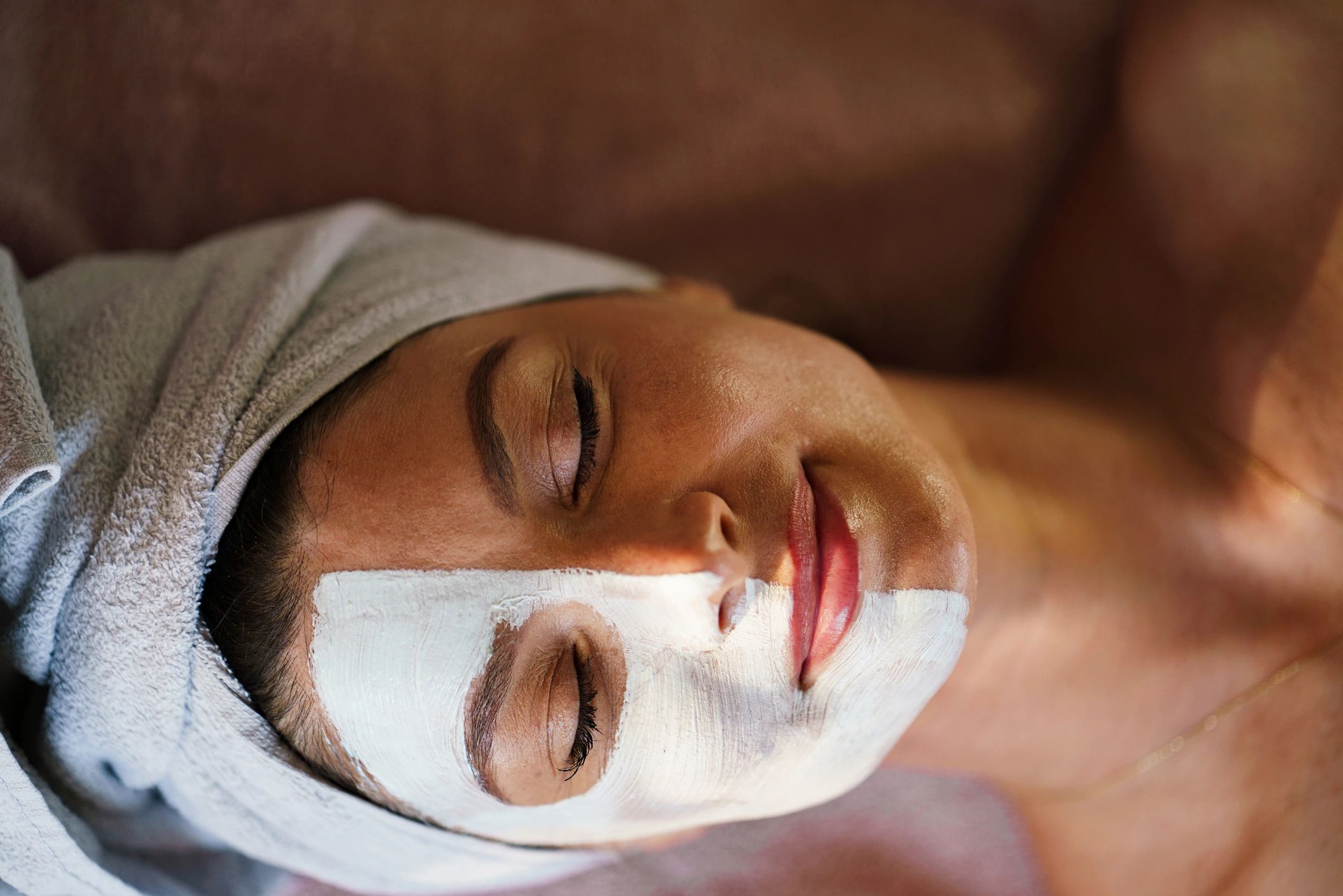 Client receiving a relaxing facial treatment
