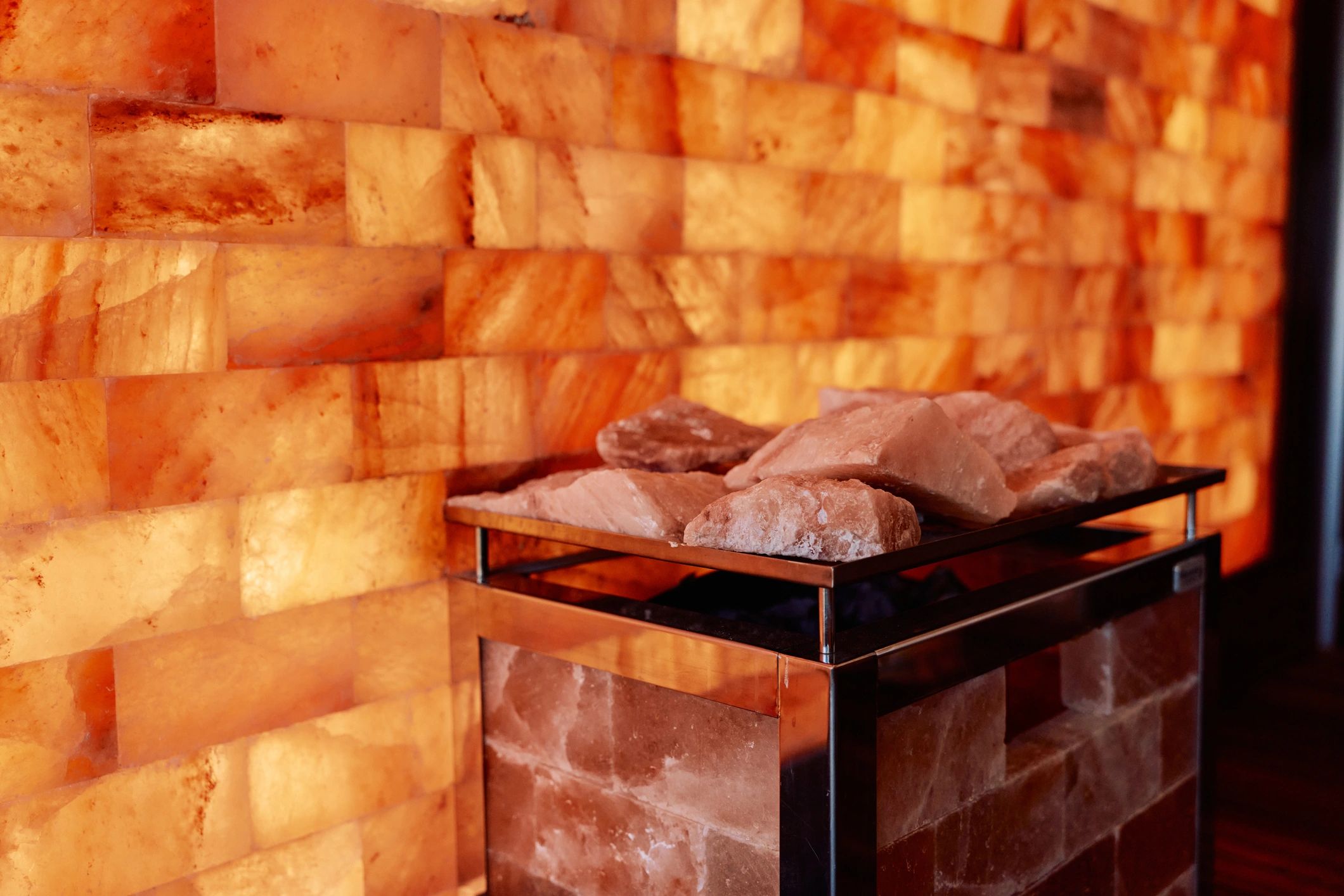 Warm, glowing sauna wall for wellness and recovery